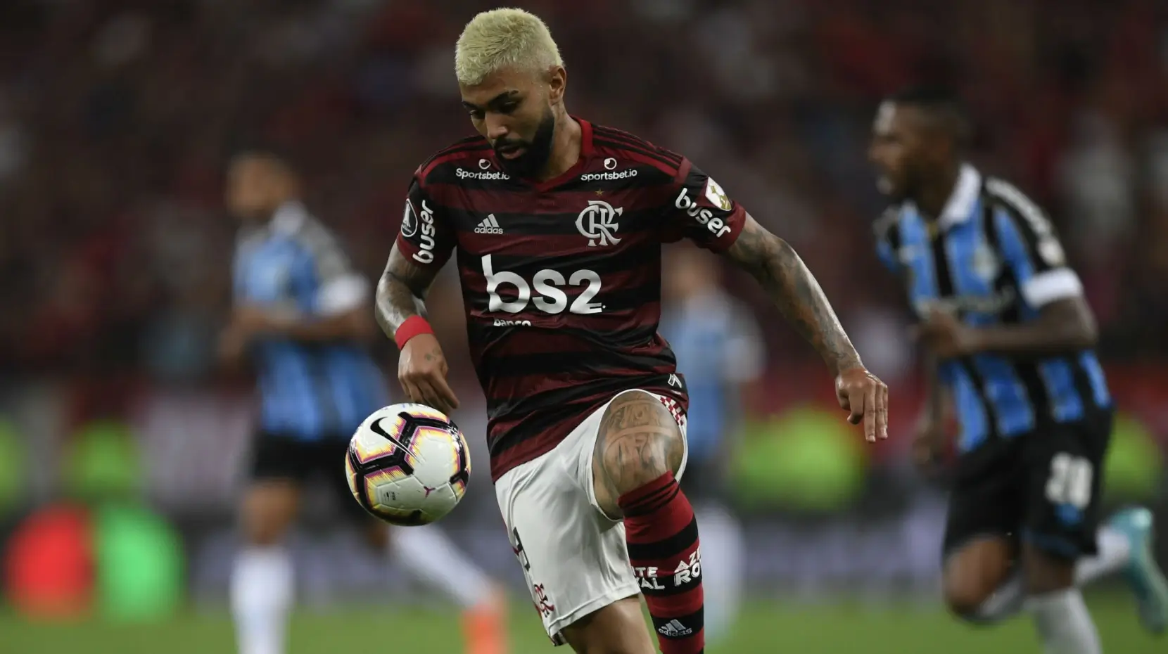 Flamengo player controlling the ball in stadium action — 1xBet Login